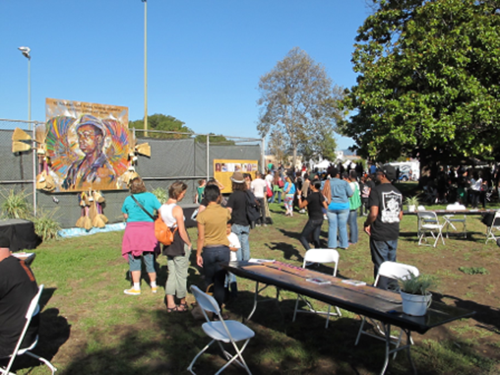 People observing art in a public park