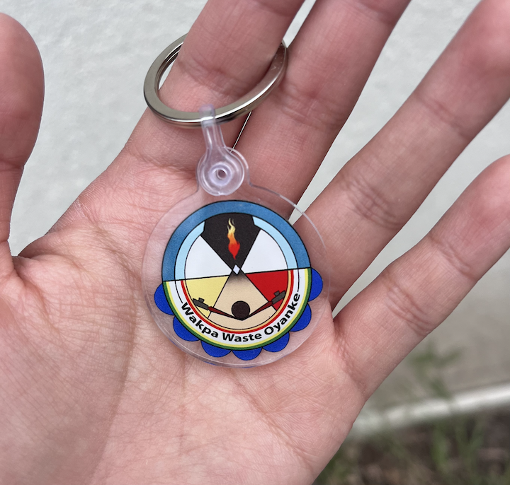 hand holding key chain with logo