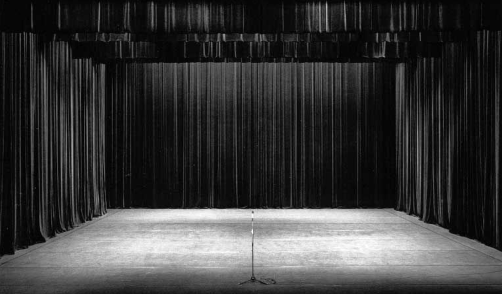Black & white photo of an empty stage