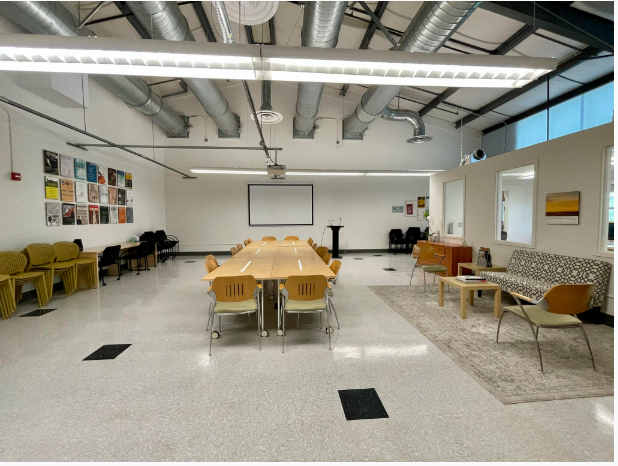 empty room with long table and chairs