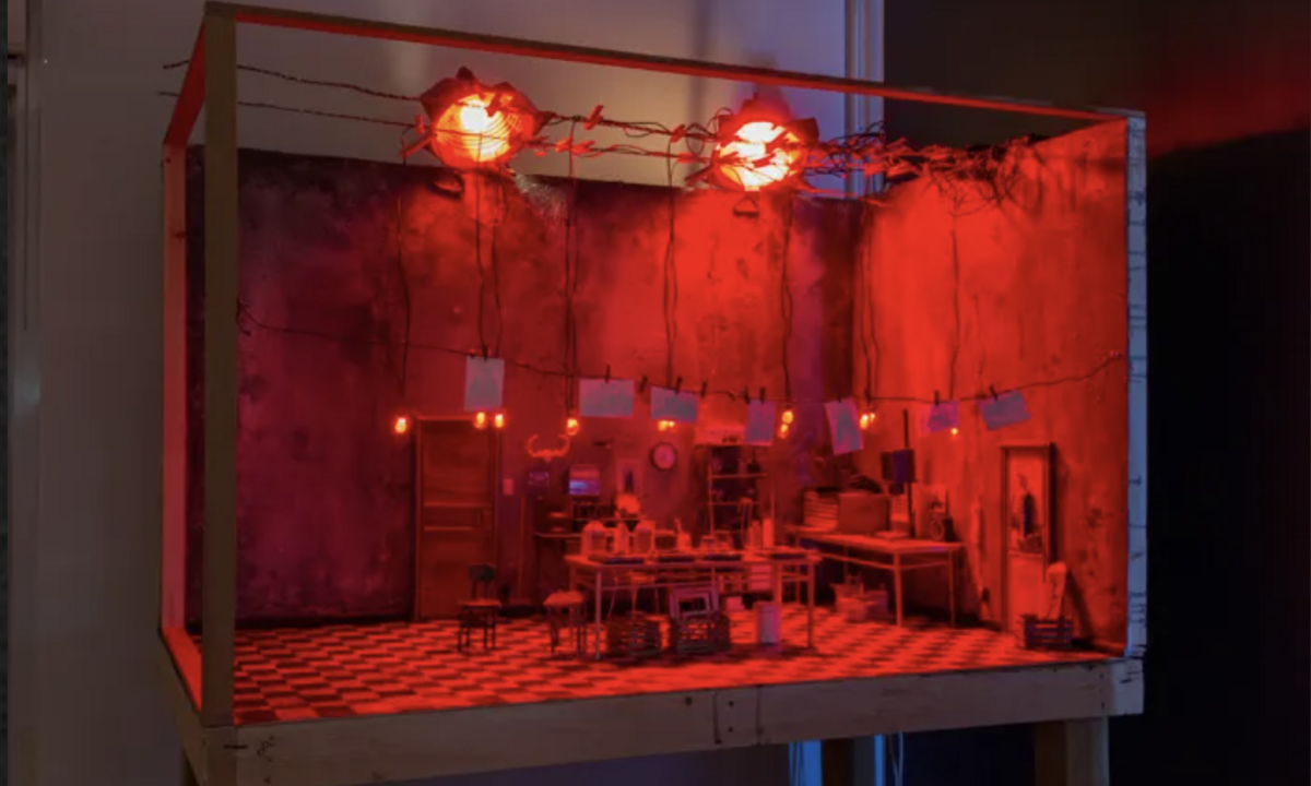 film set of a kitchen for stop motion animation bathed in red light