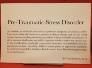 Sign titled "Pre-Traumatic-Stress Disorder" describing the condition by Lise Van Susteren, 2013.